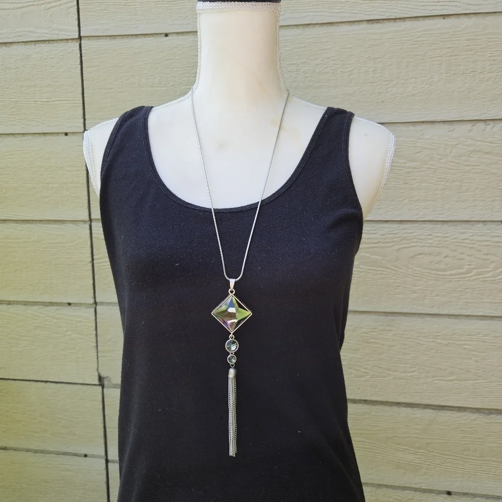 long silver tone chain necklace with tiered gray pendant and tassel
